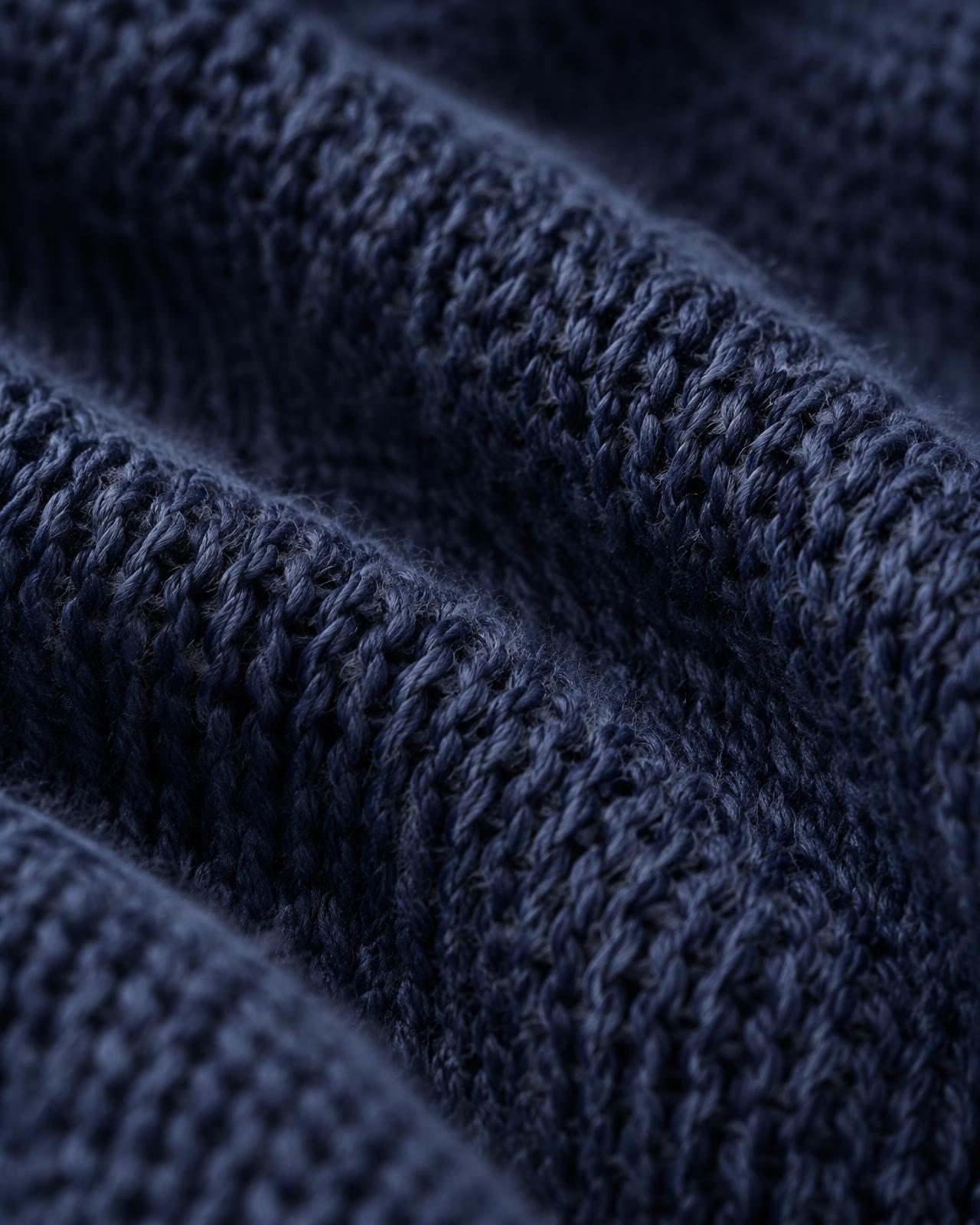 Macro view of a navy knitted fabric